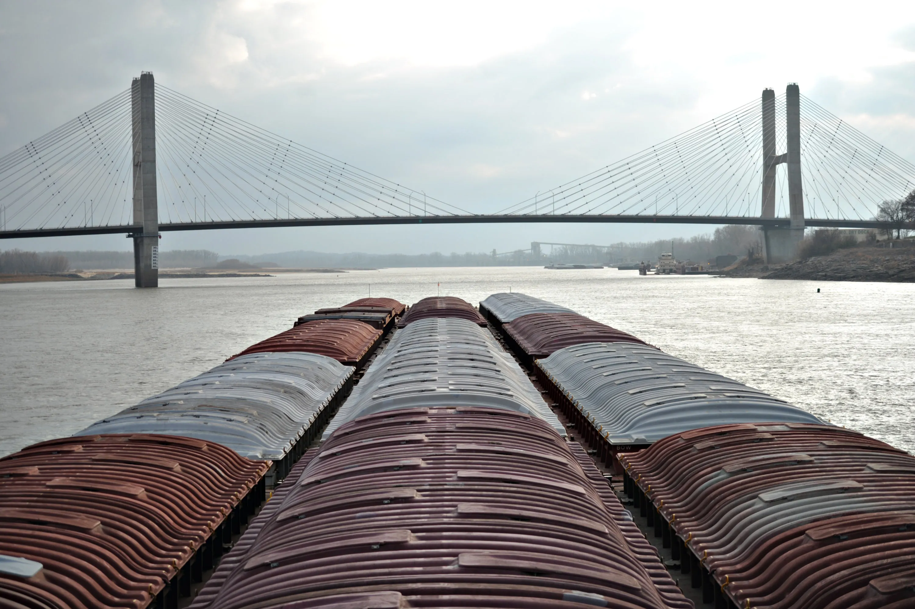 A tow boat pushes grain barges down the Mississippi River.