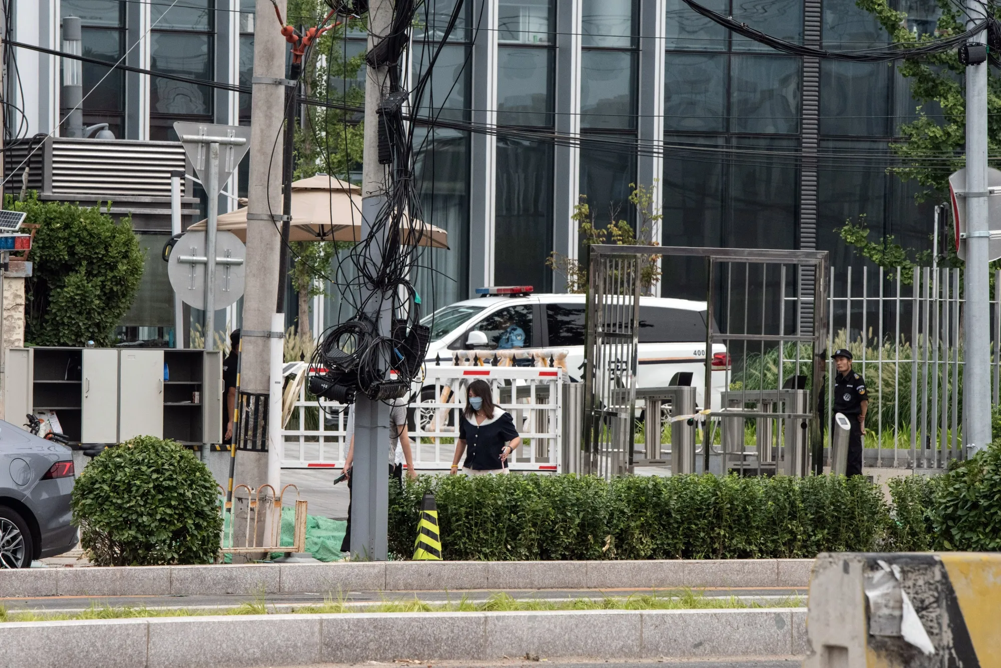 A police vehicle parked outside the Zhongrong offices in Beijing on Aug. 17.