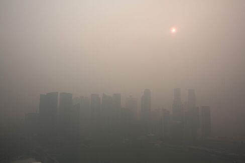 The city skyline at Marina Bay as buildings in the central business district stand shrouded in smog.