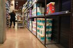 Empty shelves in the toilet paper aisle at Harmons Grocery store in Salt Lake City, Utah,
