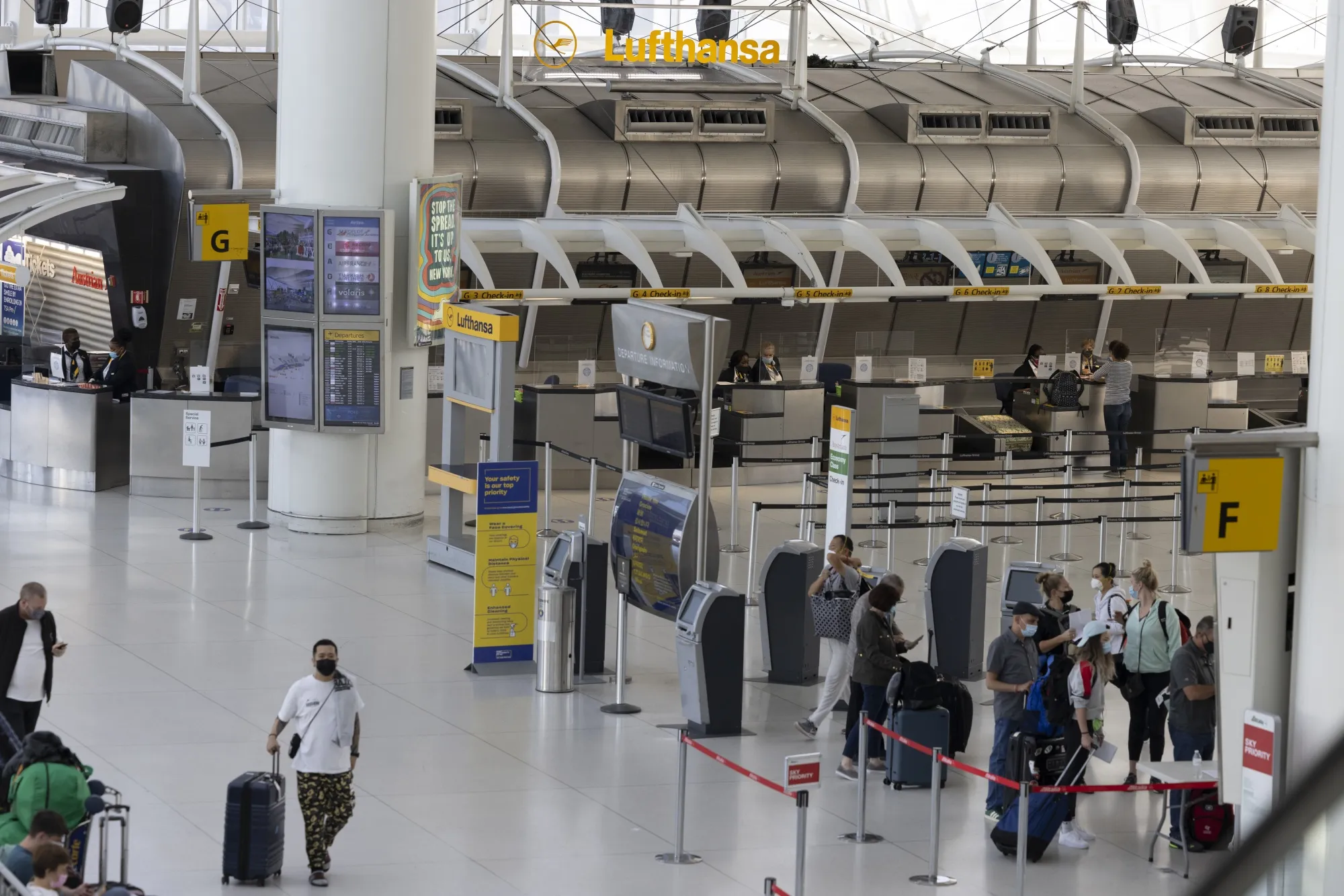 Travelers at a Lufthansa check-in counter&nbsp;at John F. Kennedy International Airport (JFK) in New York, U.S., in September.