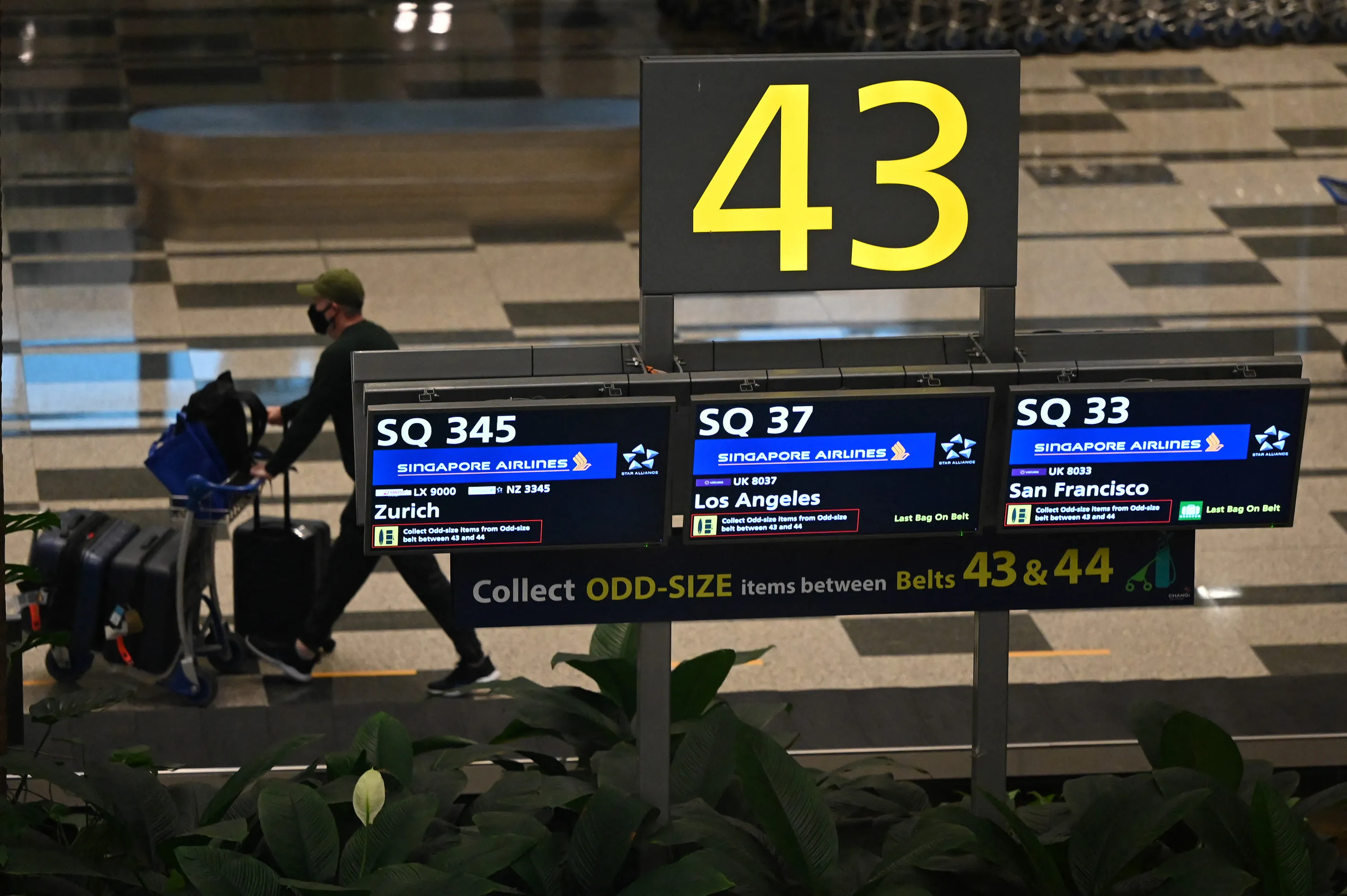 A passenger on Singapore Airlines flight arrives, under the Vaccinated Travel Lane, at Changi Airport in Singapore.
