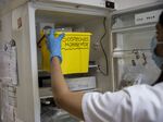 A laboratory technician picks up suspected monkeypox samples&nbsp;in Madrid