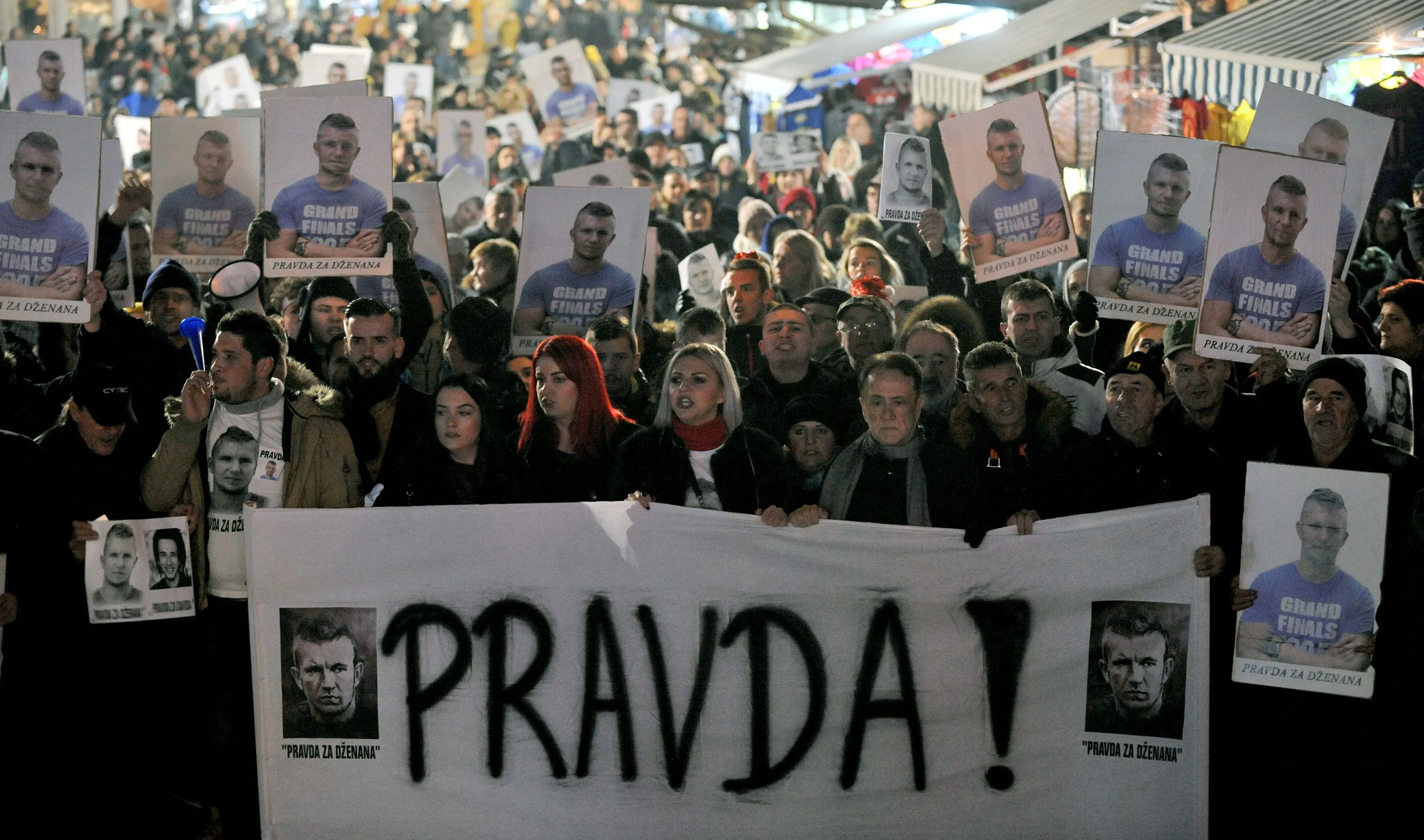Protestors hold a banner reading ’Justice’ in Sarajevo, on Dec. 30.
