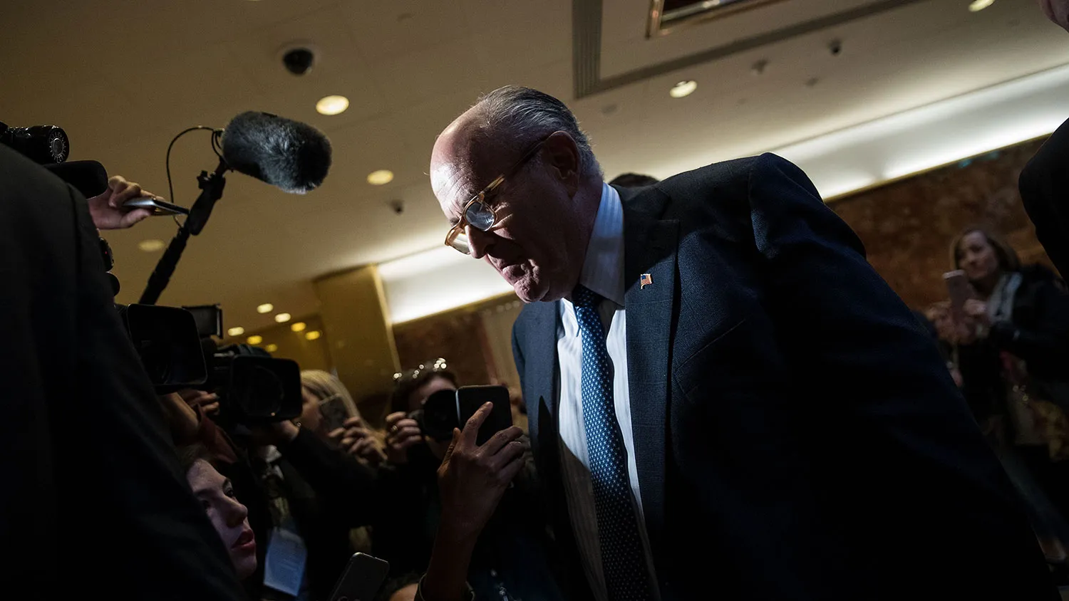 Former New York City Mayor Rudy Giuliani speaks briefly with the media on his way out of the lobby of Trump Tower on Nov. 11, 2016, in New York City.
