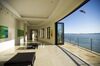 A pelican flies by the gallery room of a 15,000 square-foot custom built home on Belvedere Island in Marin County, California, U.S., on Wednesday, Dec. 19, 2012. The builder couldn't find a buyer for the brand-new waterfront mansion he listed in January for $45 million. He hopes one will turn up at a Dec. 30 auction, where the starting bid will be $25 million.