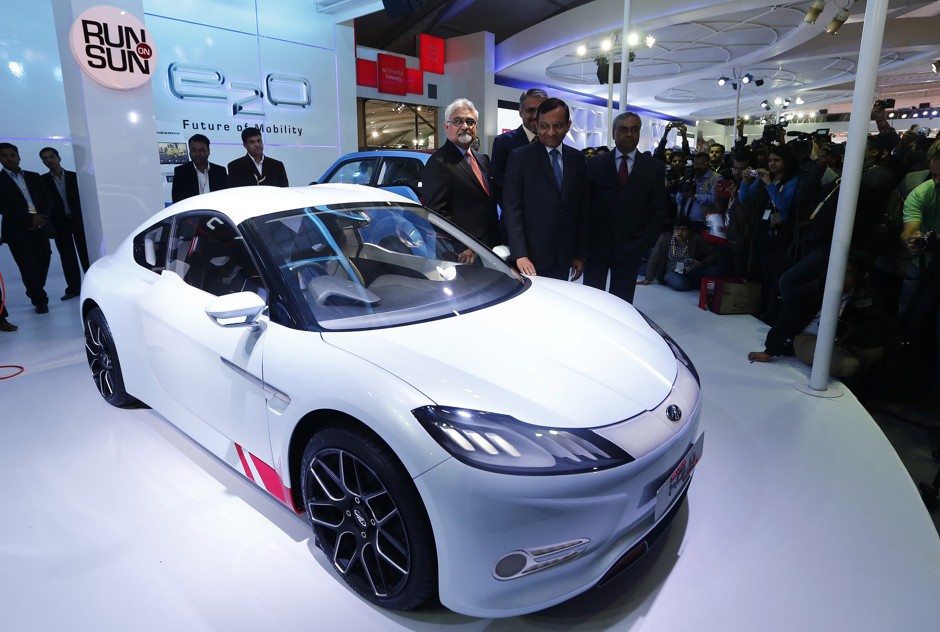 Pawan Goenka, president of India's EV company, Mahindra & Mahindra, displays a new electric sports car in 2014.