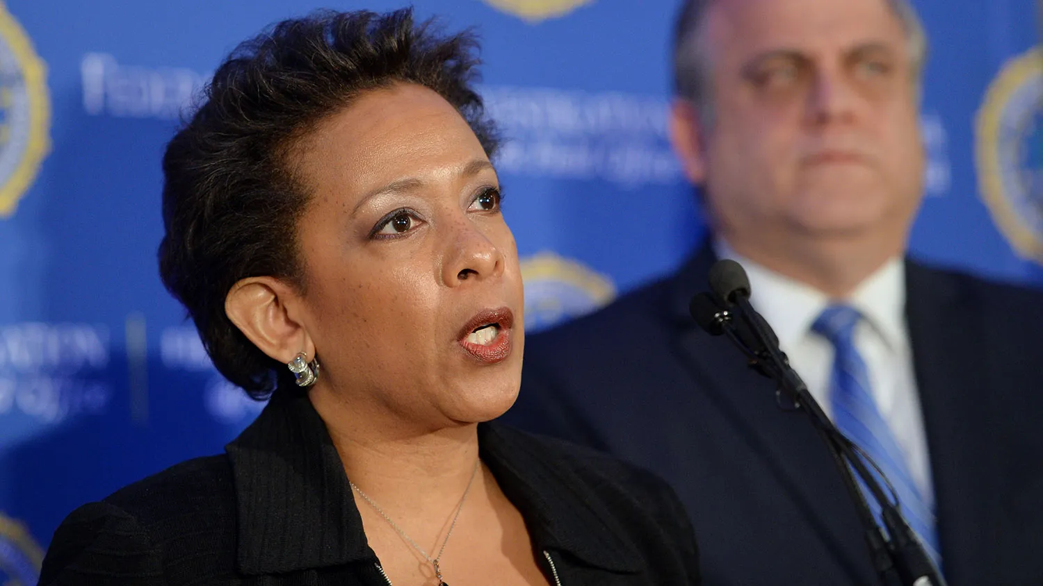 US Attorney for the Eastern District of New York Loretta Lynch (L) and FBI Assistant Director-in-Charge George Venizelos (R) announce that Juan Elias Garcia, also known as 'Cruzito', from El Salvador, has been added to FBIs Ten Most Wanted Fugitives March 26, 2014 in New York.
