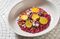 The beet risotto at Little Park is topped with golden beets, dill flowers, and goat cheese.