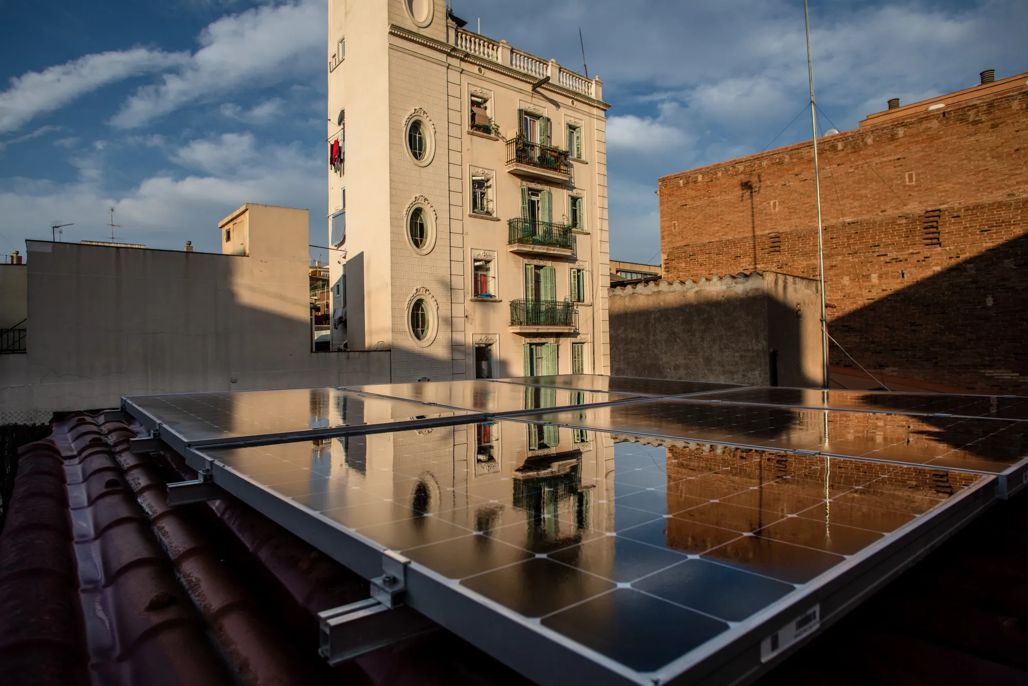 Solar panels on the roof of a residential apartment building in Barcelona.