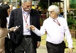 Chase Carey, left, walks with Bernie Ecclestone on Sept. 16, 2016 in Singapore.
