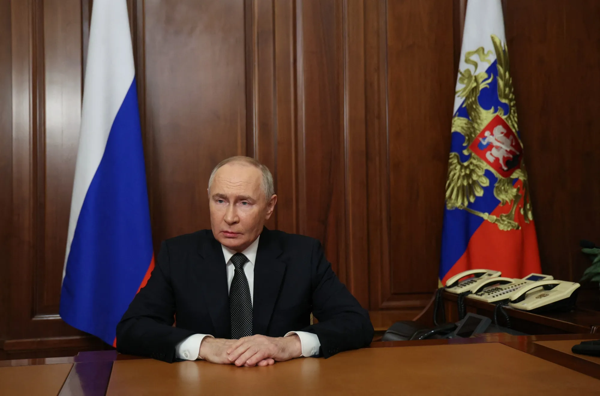 In this pool photograph distributed by the Russian state agency Sputnik,&nbsp;Vladimir Putin delivers a televised address to the nation in Moscow, on Nov. 21.&nbsp;