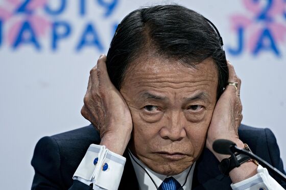 Japan’s Aso Signals New Openness to Introducing 50-Year Bonds