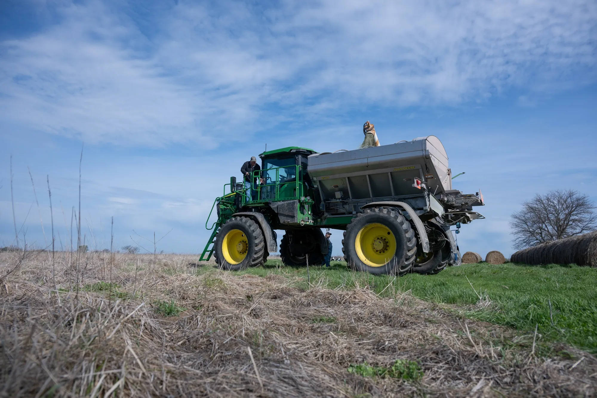 Granular blend fertilizer is loaded into a spreader on a farm near Montrose, Missouri, US.