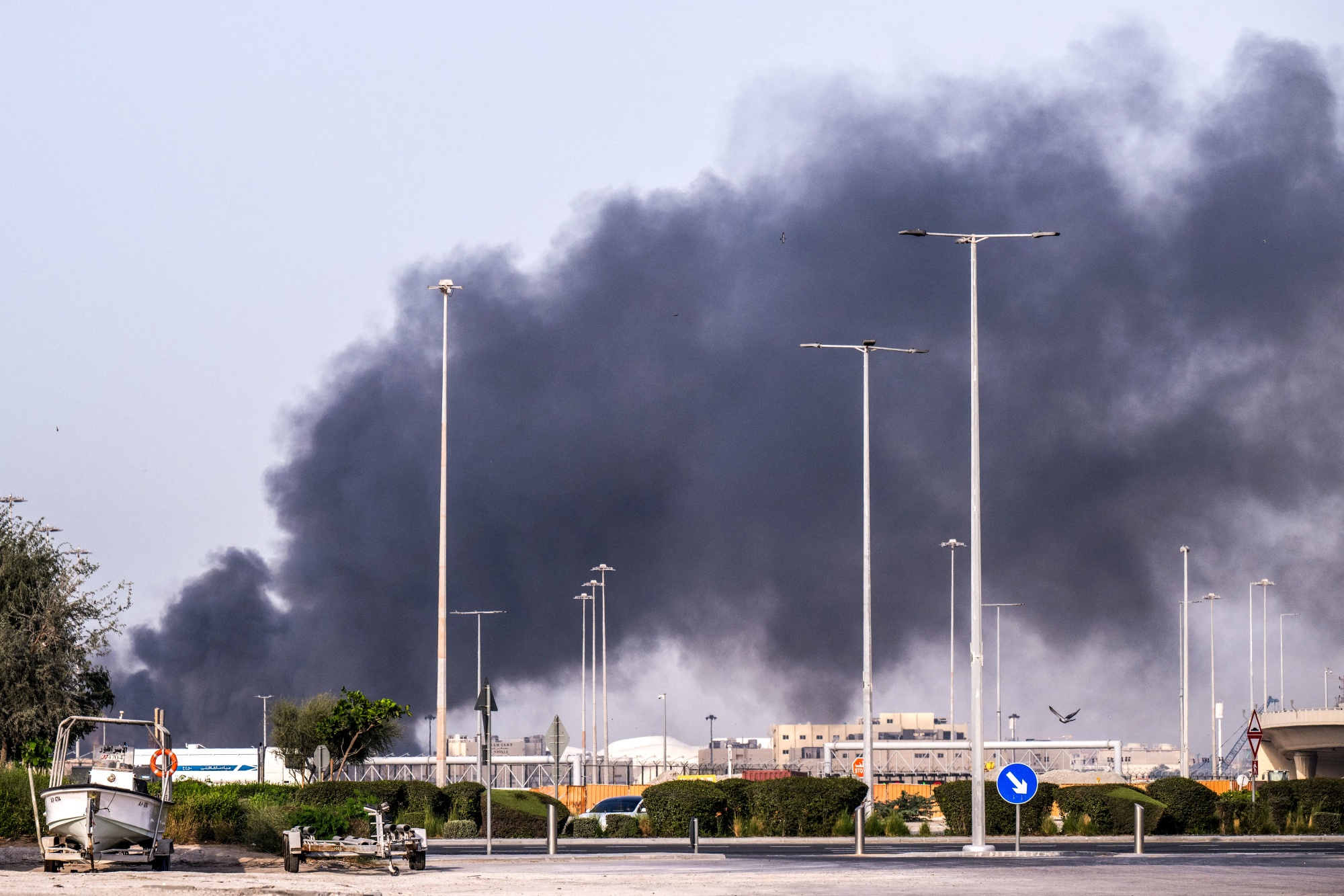 A plume of smoke rises from the Zayed Port following a reported Iranian strike in Abu Dhabi.