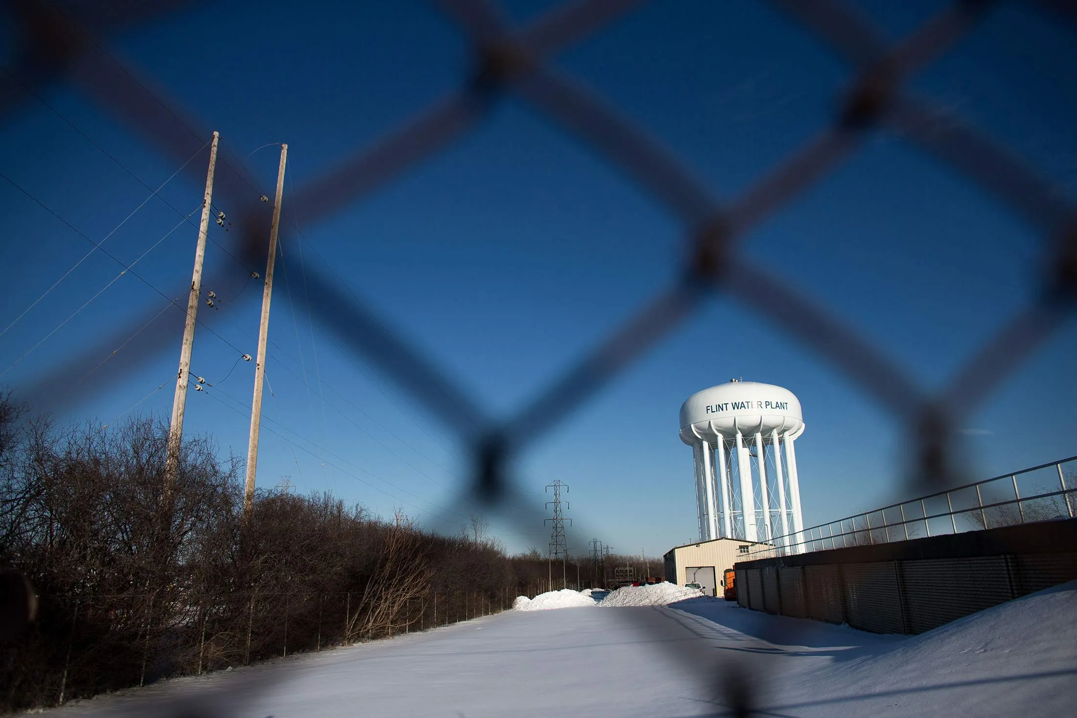 The water tower at the Flint Water Plant in Flint, Michigan, looms large over the city March 4, 2016 nearly 2 years after the start of the city's water crisis.
