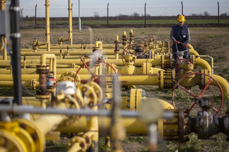 A worker adjusts a valve wheel at the Batajnica gas storage facility in Batajnica, Serbia.