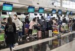 Passengers check-in for Singapore Airline at Hong Kong International Airport in February.&nbsp;
