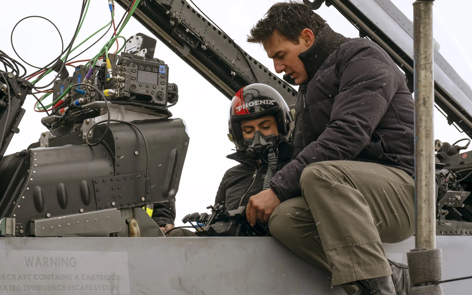 Monica Barbaro and Tom Cruise on the set of “Top Gun: Maverick.”