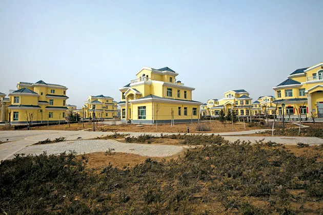 Chinese savers helped fund construction of Kangbashi, the cultural district of Ordos, where buildings now sit empty