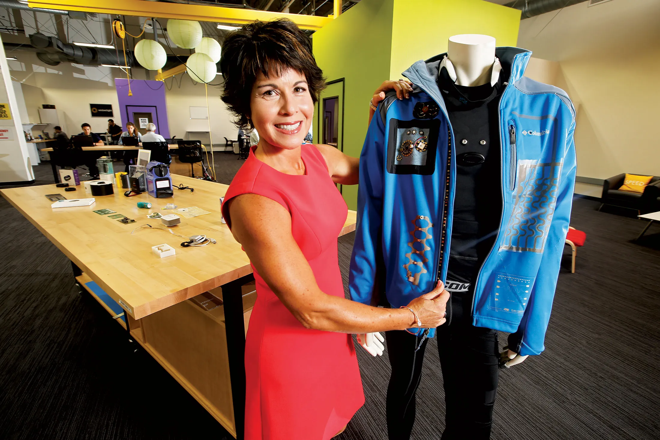 Sargent with Flex’s smart jacket. More than 60 sensors and components are built in. Background: Startups working at Flex’s accelerator.
