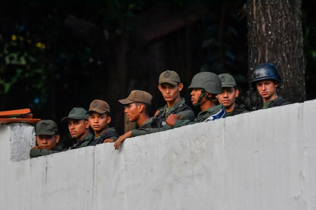 Members of Venezuela’s national guard stay inside their base after an attempted mutiny.