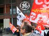 General manager of General Electric Power France, Antoine Peyratout (2L) listens to GE's employees and union representatives as they protest to keep their plant in operation in front of the GE headquarter in Belfort, eastern France, on May 21, 2019. - US energy giant General Electric plans to slash up to 468 jobs across France, union sources said January 22, 2019. 229 jobs would be cut from the staff at Alstom Power Systems (APS), including 146 at GE Energy's European headquarters in Belfort, eastern France. (Photo by SEBASTIEN BOZON / AFP) (Photo credit should read SEBASTIEN BOZON/AFP/Getty Images)