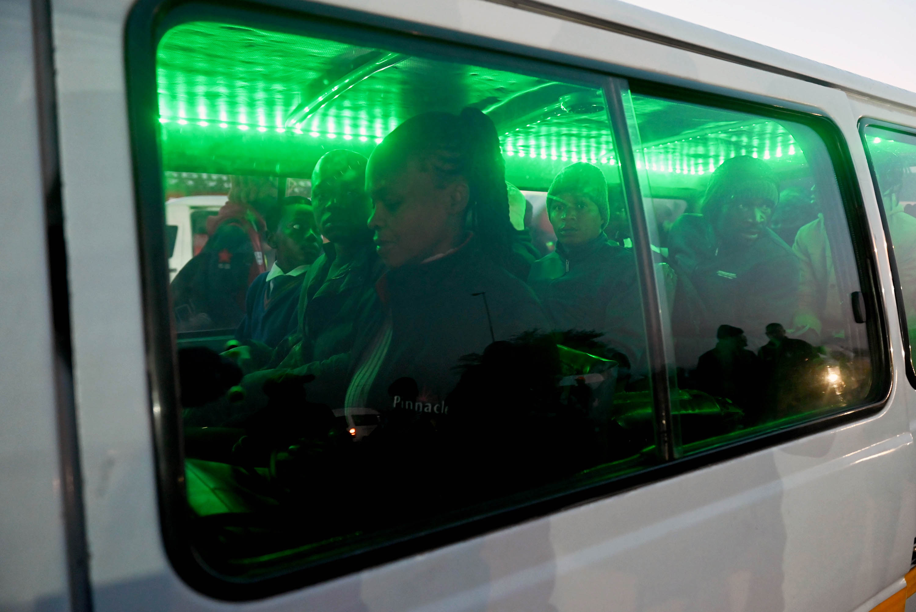 Commuters jam into a taxi in the Katlehong township.
