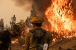 Firefighters watch a backfire operation during the Mosquito Fire near Volcanoville, California, on Sept. 9, 2022.