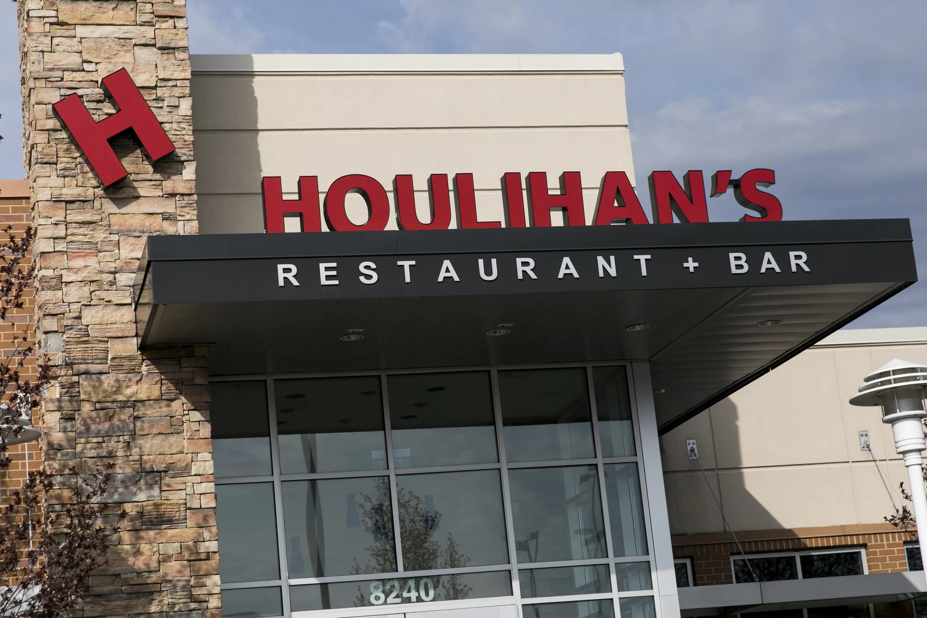 A sign sits outside a Houlihan's restaurant in Columbia, Maryland.