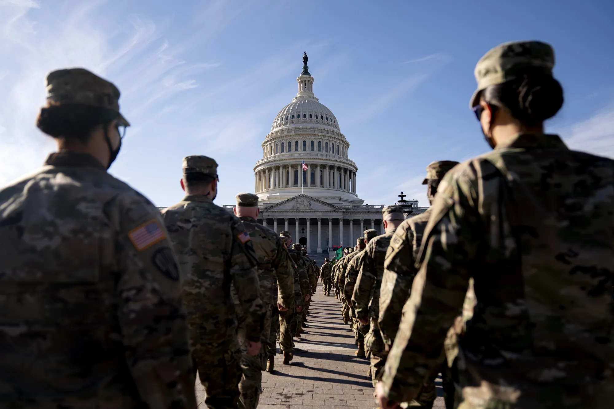 Members of the National Guard march toward the US Capitol in Washington on Jan. 22, 2021.