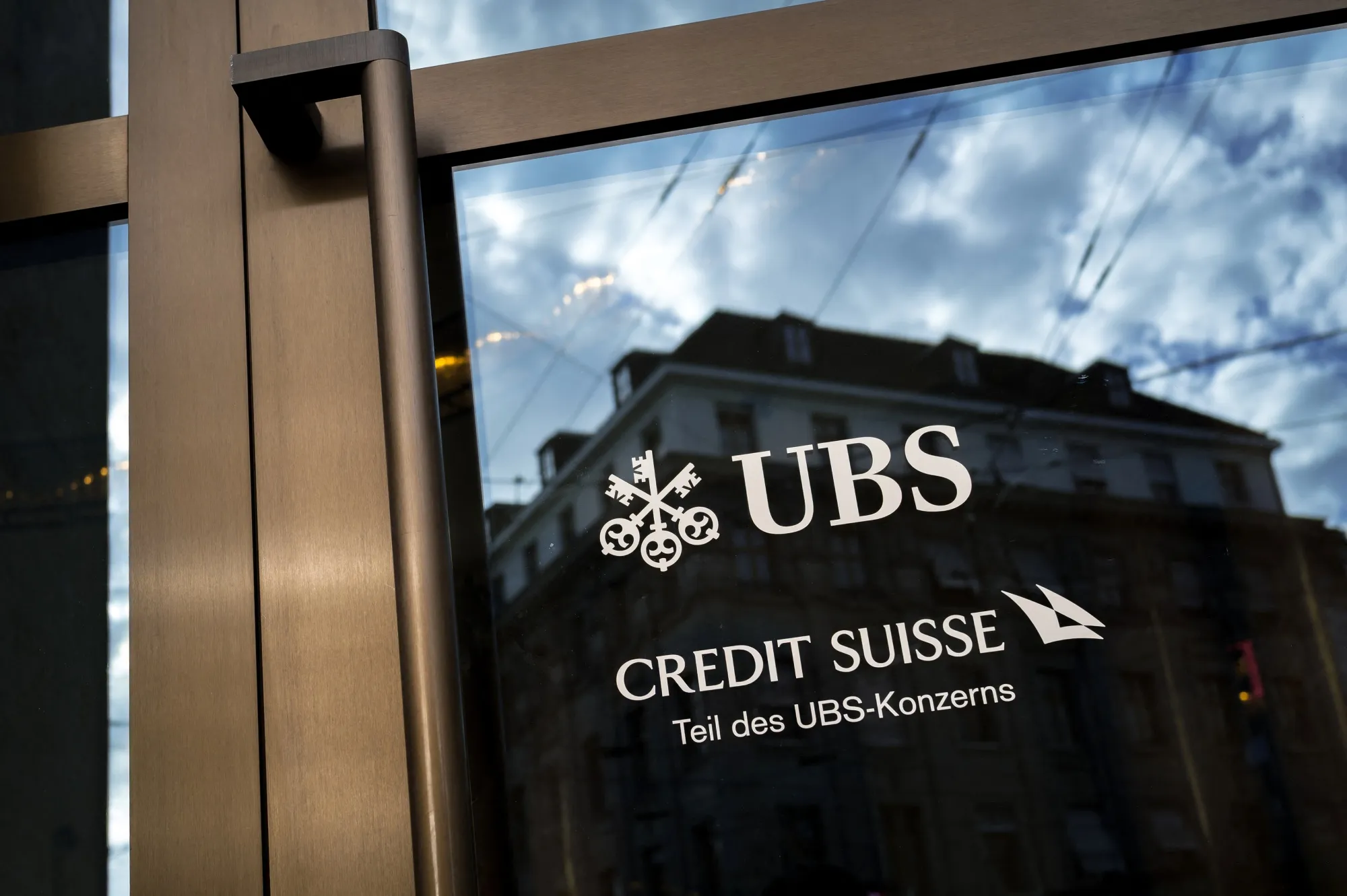 A Credit Suisse sign in a branch of UBS in Basel.