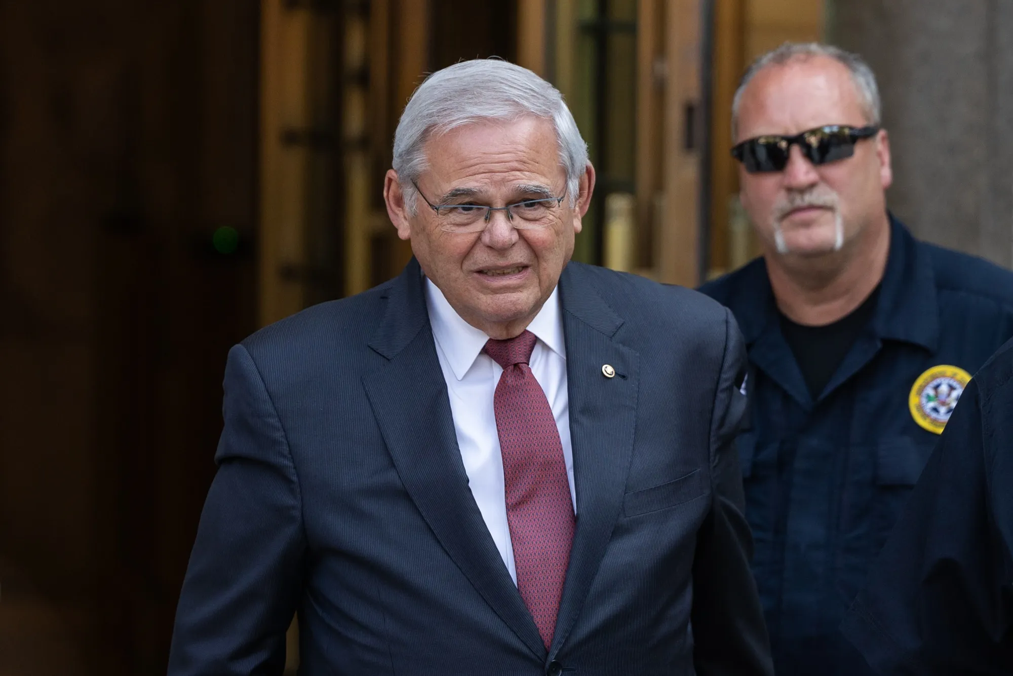 Robert Menendez exits federal court on July 15.