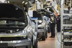 Employees work on the production line for the Lynk & Co. 05 crossover sport utility vehicle (SUV) at the Geely Automobile Holdings Ltd. plant