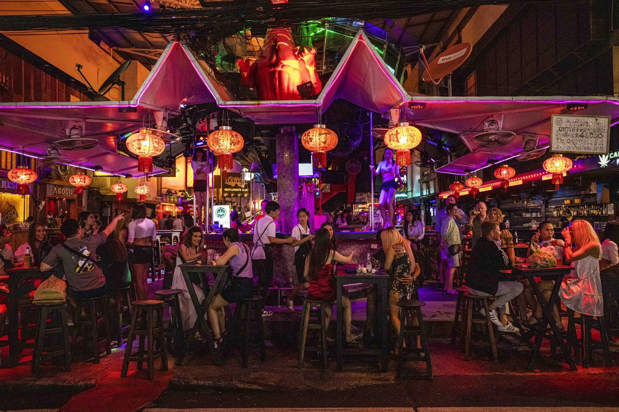 Patrons at a bar in Phuket.