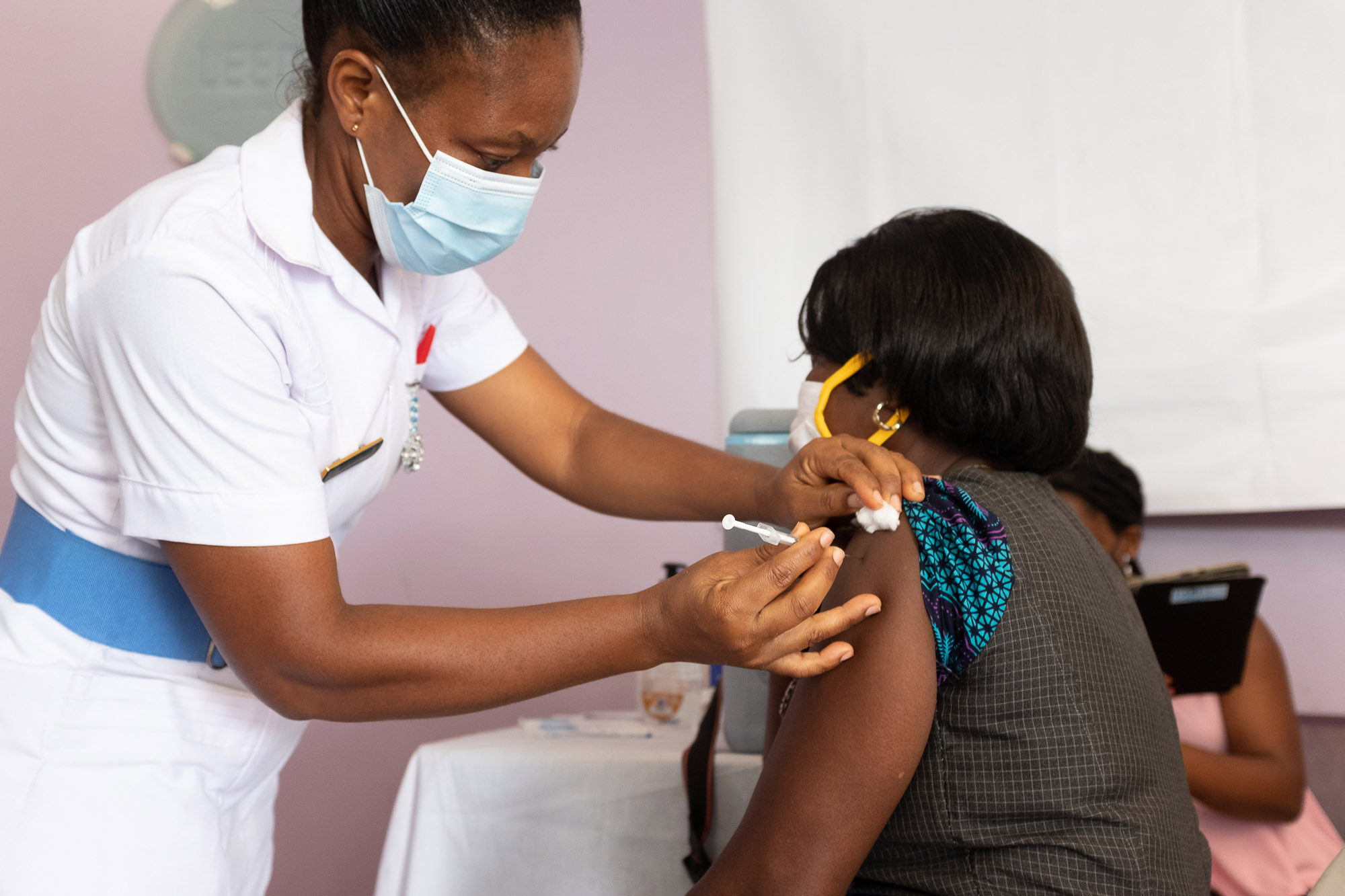 A woman receives an AstraZeneca vaccine at the Ridge Hospital in Accra, Ghana.