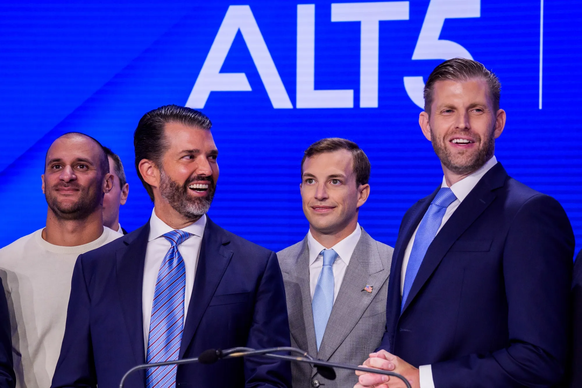 Donald Trump Jr. and Eric Trump, with World Liberty Financial Inc. founders, at the Nasdaq MarketSite in New York.