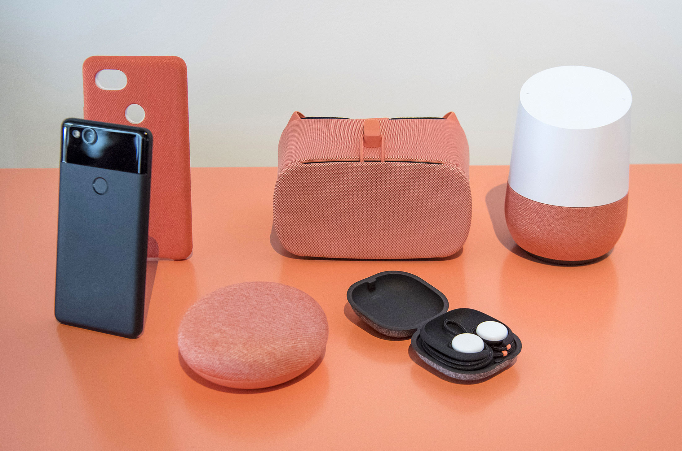 The Google Pixel 2 smartphone, from left, Home Mini voice speaker, Daydream virtual reality headset, Pixel Buds headphones and Google Home device are arranged for a photograph during a product launch event in San Francisco, California, U.S., on Wednesday, Oct. 4, 2017.