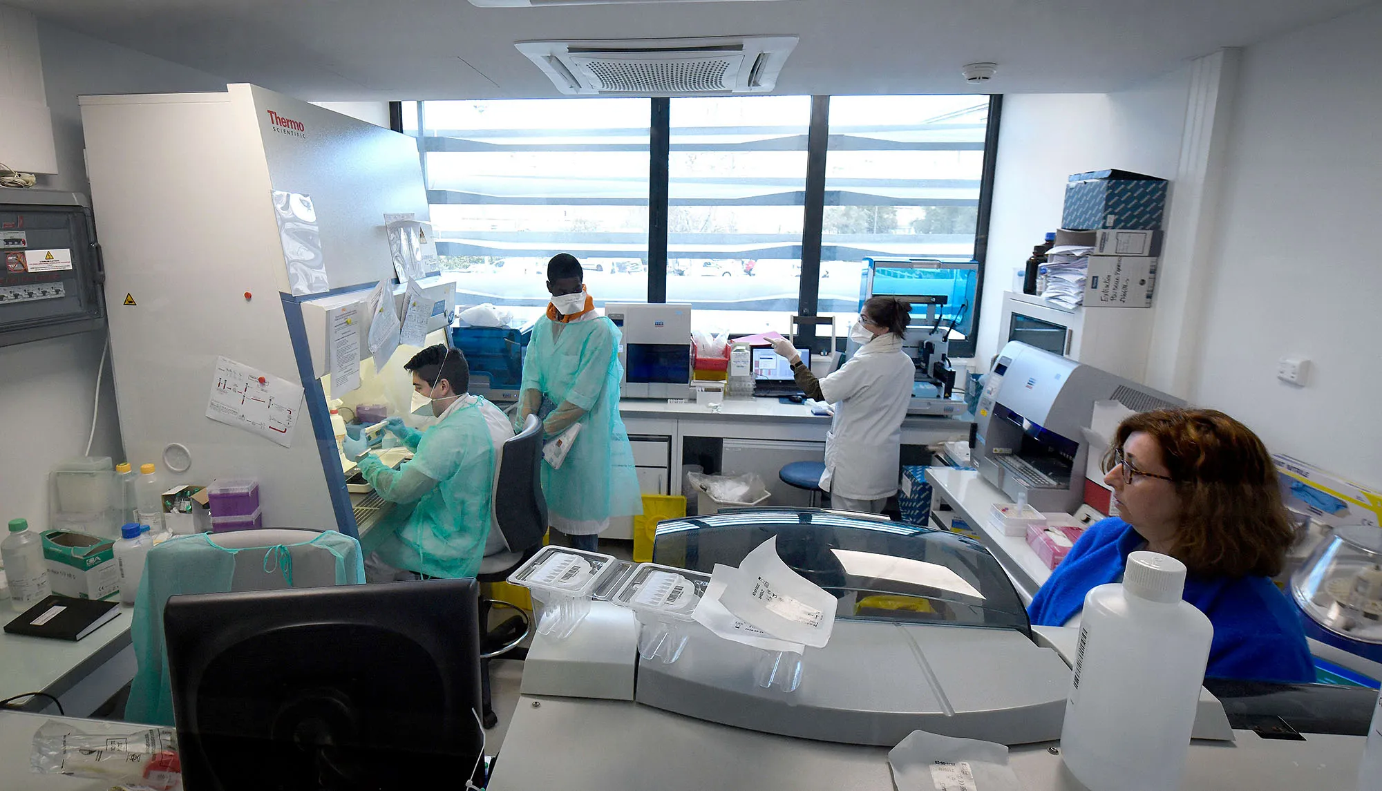 Medical staff at work at a laboratory to analyse samples on the possible coronavirus in Marseille on Feb. 26.