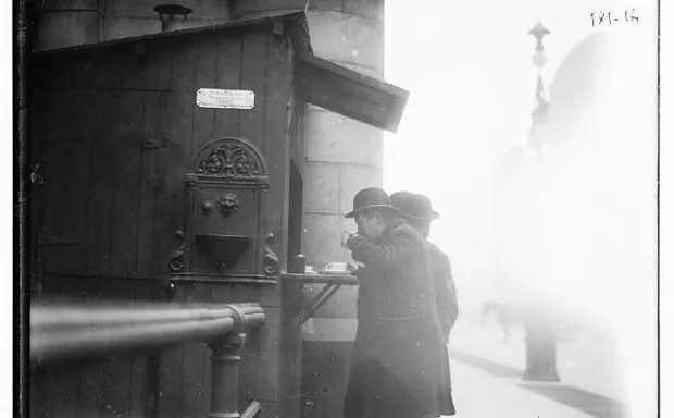 Men drinking coffee at the "One Cent Coffee Stand" of the Greater N.Y. Philanthropic Society.