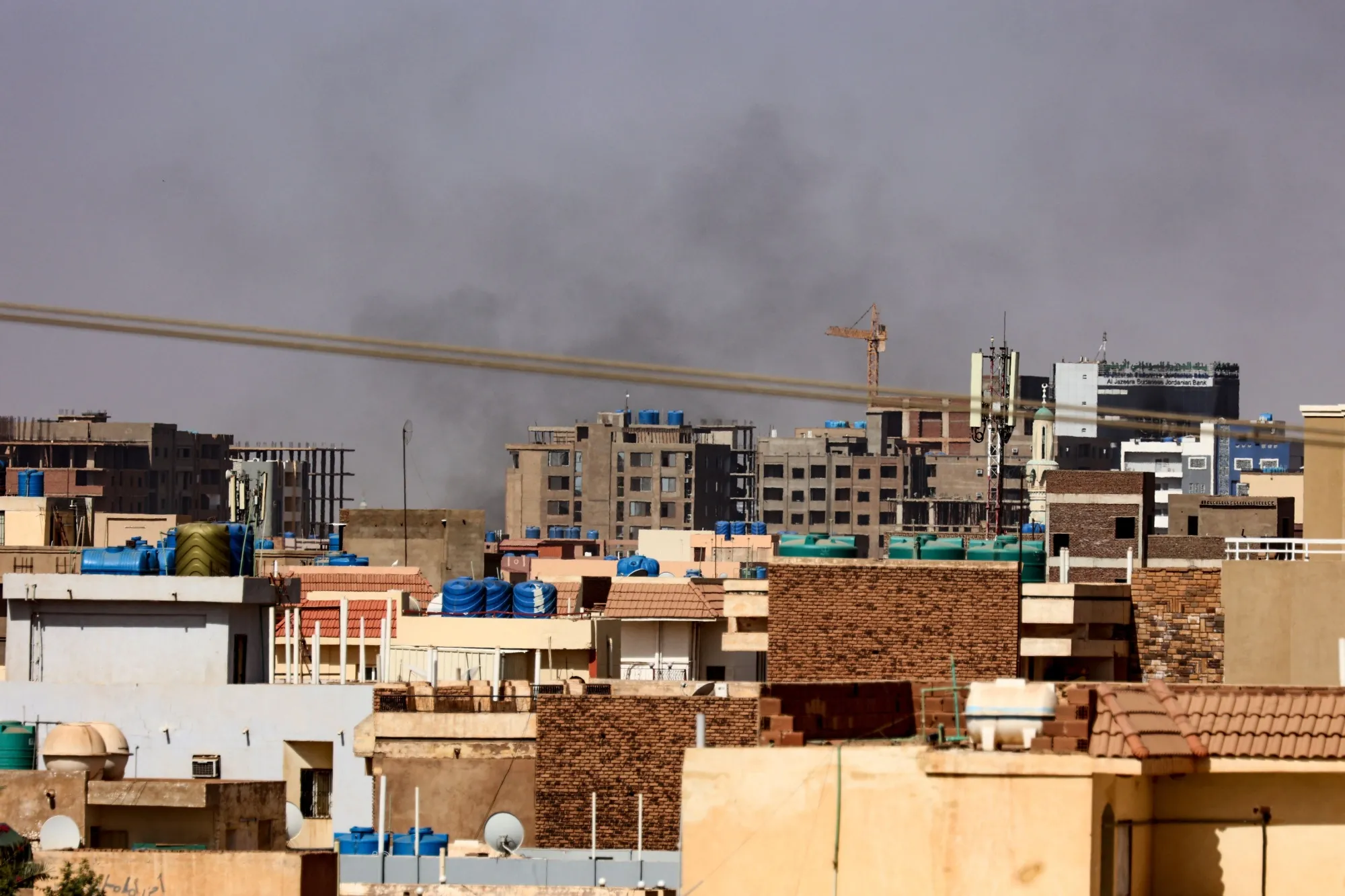 Smoke billows over residential buildings in eastern Khartoum on April 22.