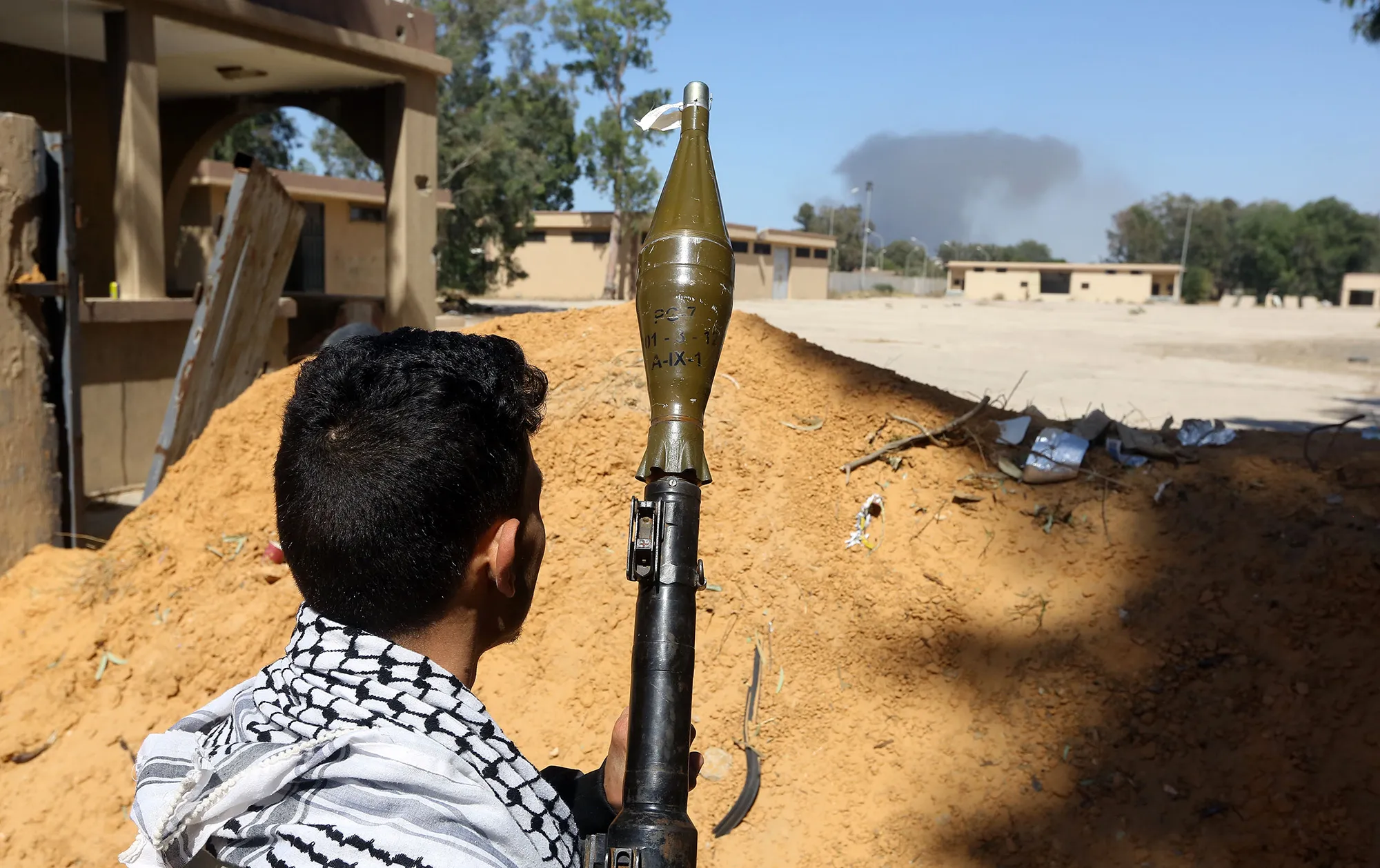 A fighter loyal to the internationally recognized Libyan Government of National Accord (GNA) holds a rocket propelled grenade launcher as he keeps position near the Salah al-Din military compound, south of the Libyan capital Tripoli, on May 7, 2019.