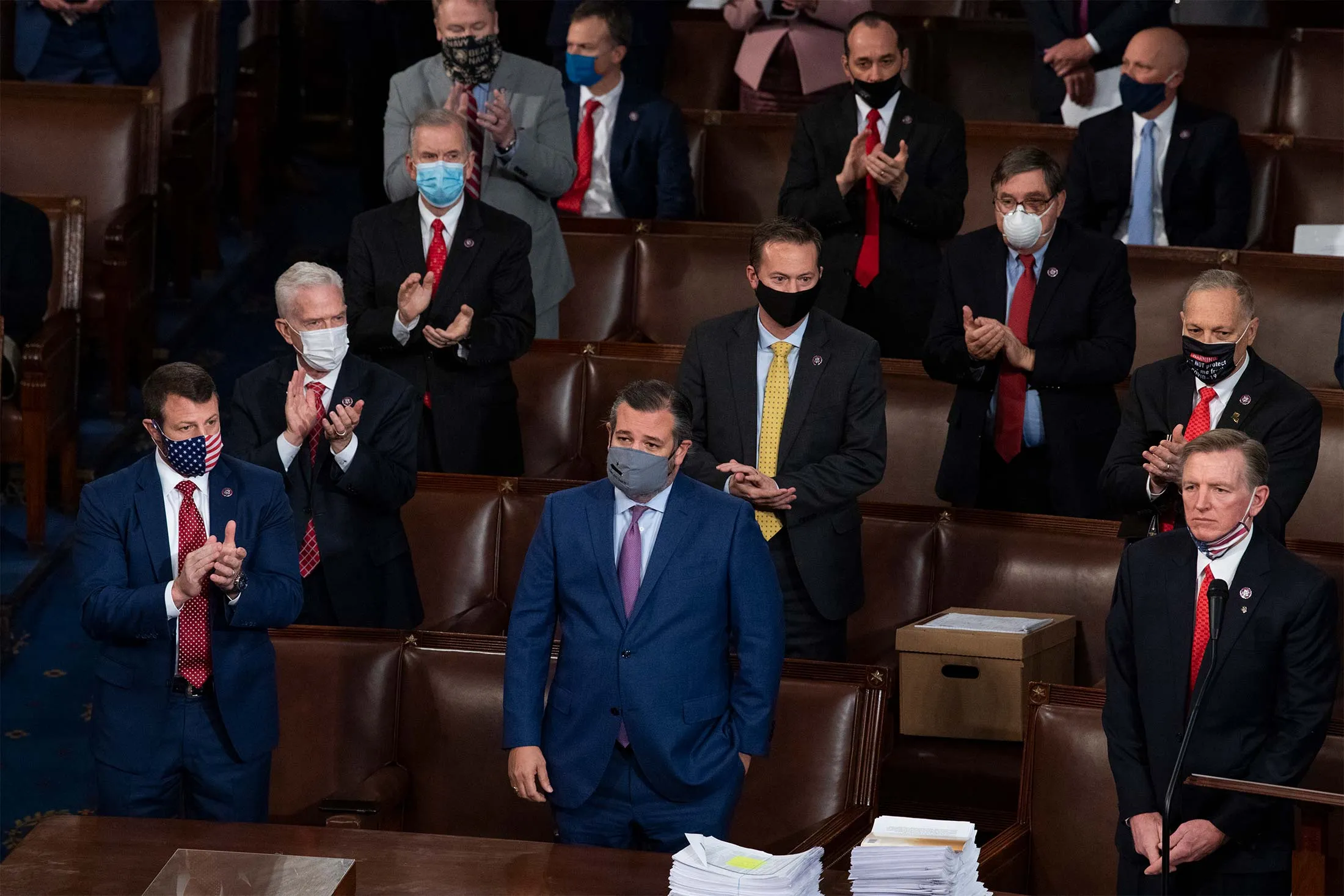 Sen. Ted Cruz, front and center, and Rep. Paul Gosar, far right, are applauded by Republican colleagues for objecting to Arizonas Electoral College vote certification for Joe Biden in the House chamber on Jan. 6.
