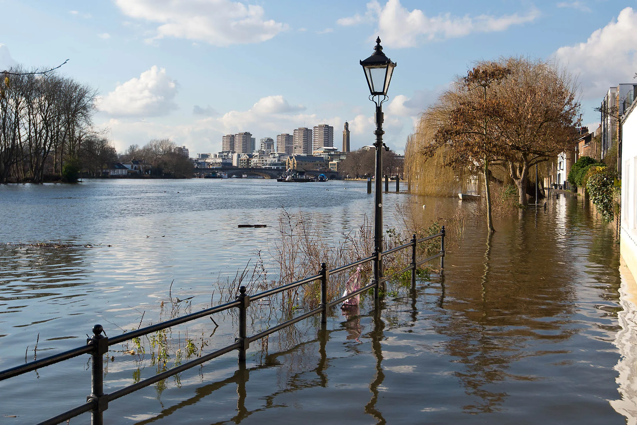LONDON, ENGLAND - FEBRUARY 23: The River Thames floods the riverside footpath at Strand-on-the-Green on February 23, 2016 in London, England. Today's high tide of 5.4 metres is predicted to flood areas along The River Thames.
