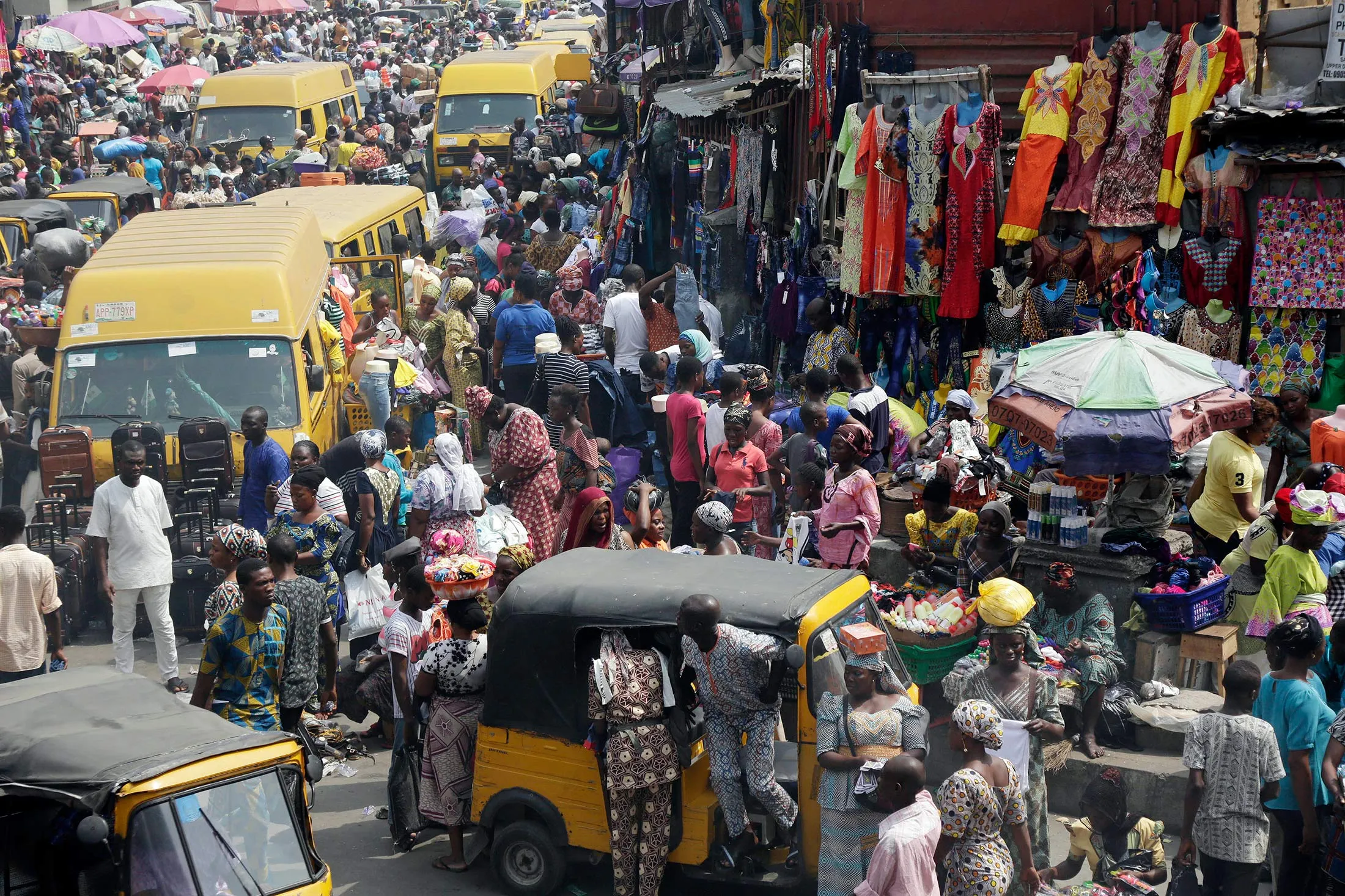 Pedestrians shop at Balogun market in Lagos, Nigeria.
