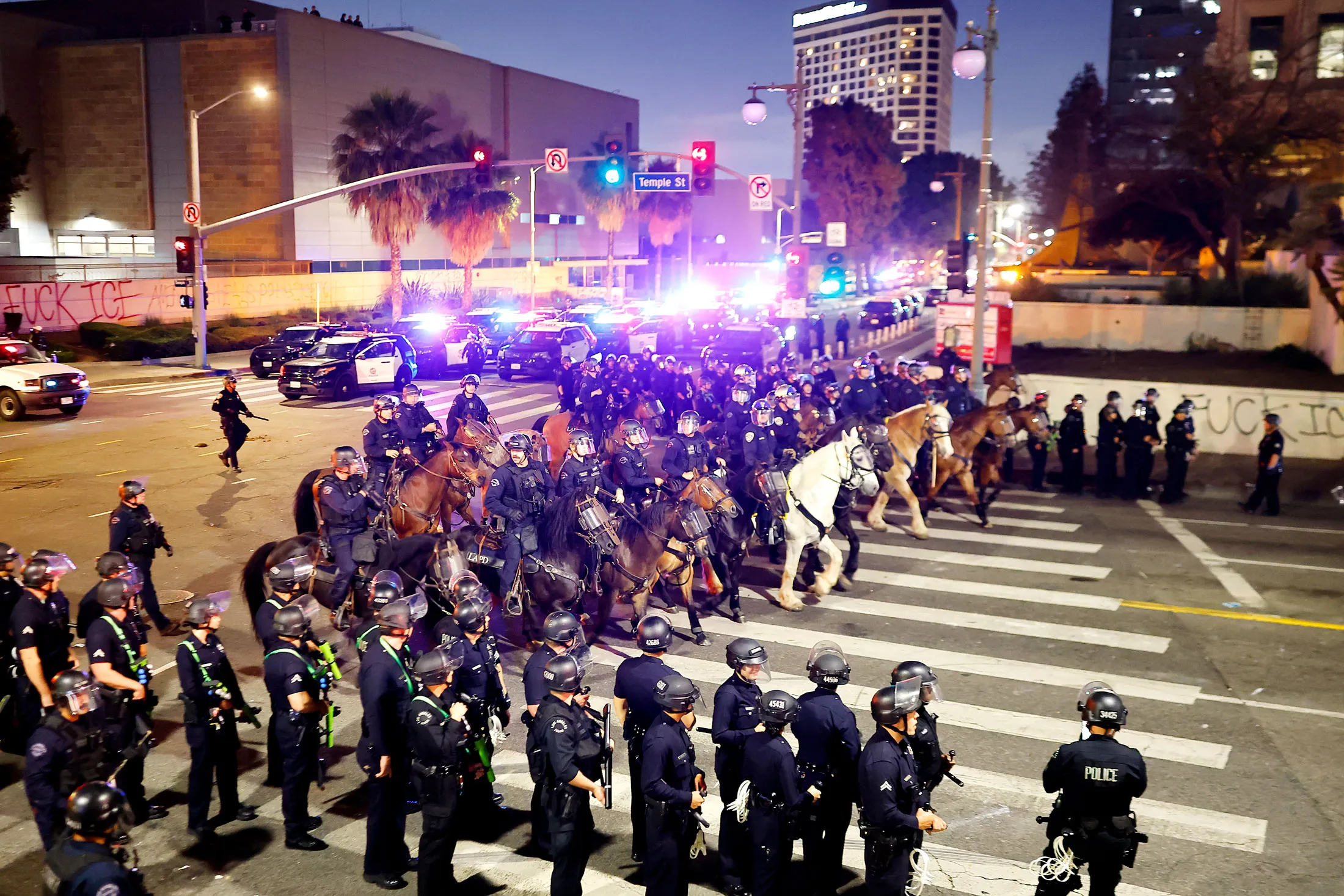 Police enforce a curfew in Los Angeles on June 10.