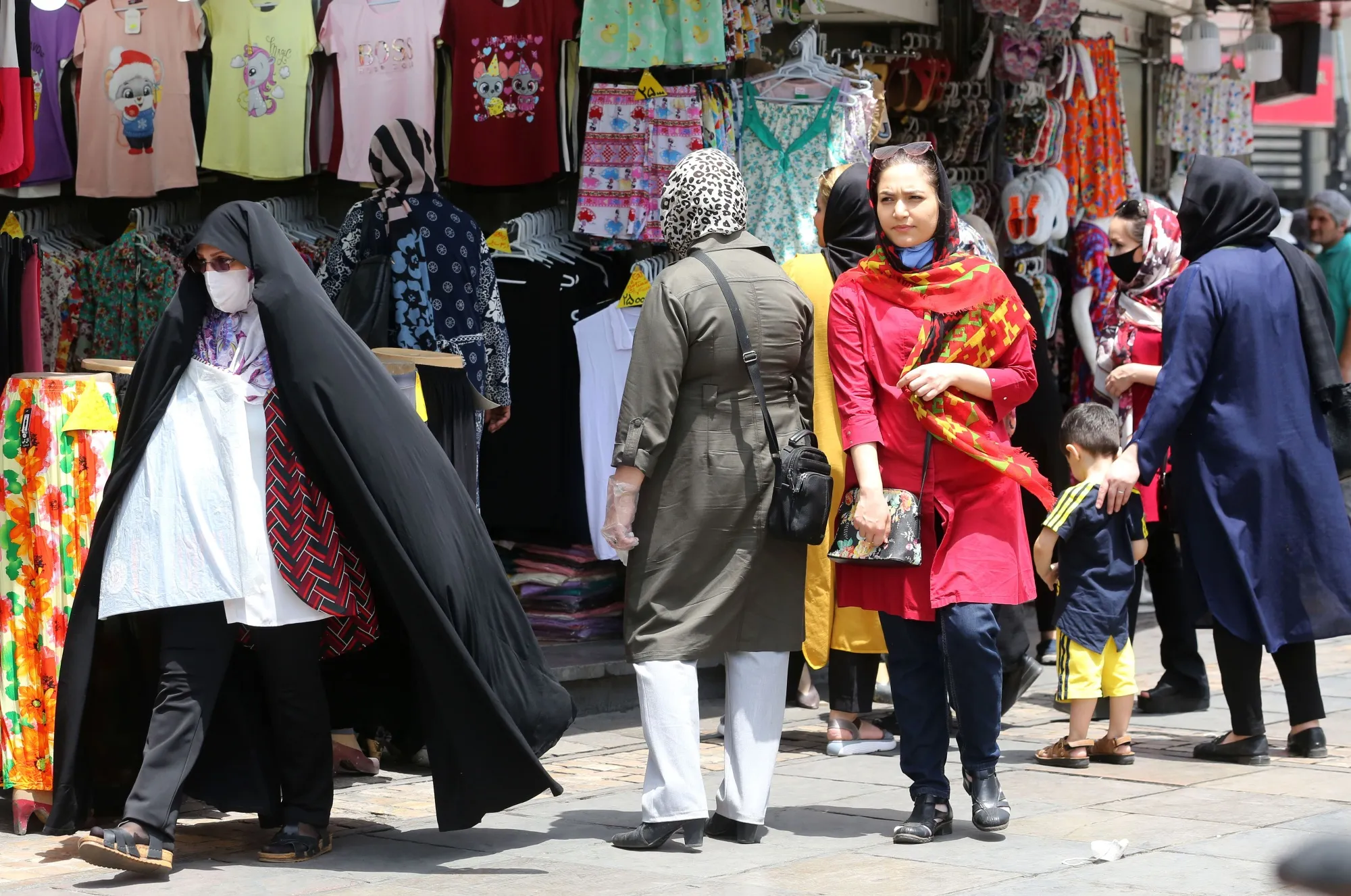 Iranians shop the capital Tehran on June 2.