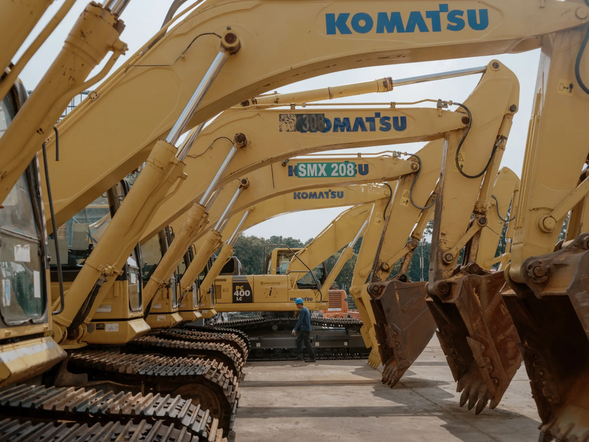 Used excavators at United Tractors' workshop in Jakarta.