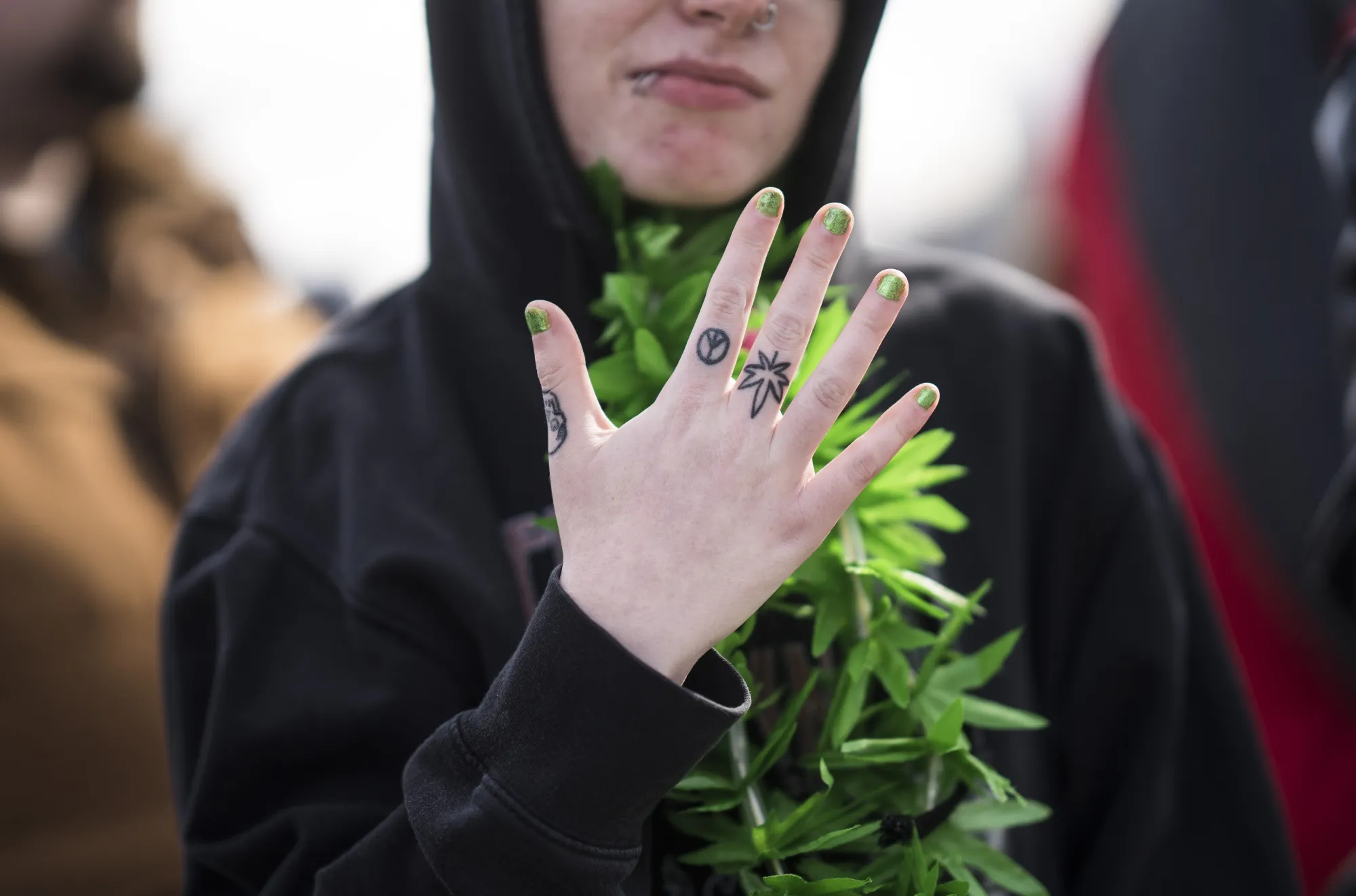 A resident shows off a marijuana leaf tattoo during the 420 Day festival on the lawns of Parliament Hill in Ottawa on April 20.