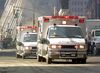 Rescue workers and vehicles move around the wreckage of the World Trade Center in 2001.